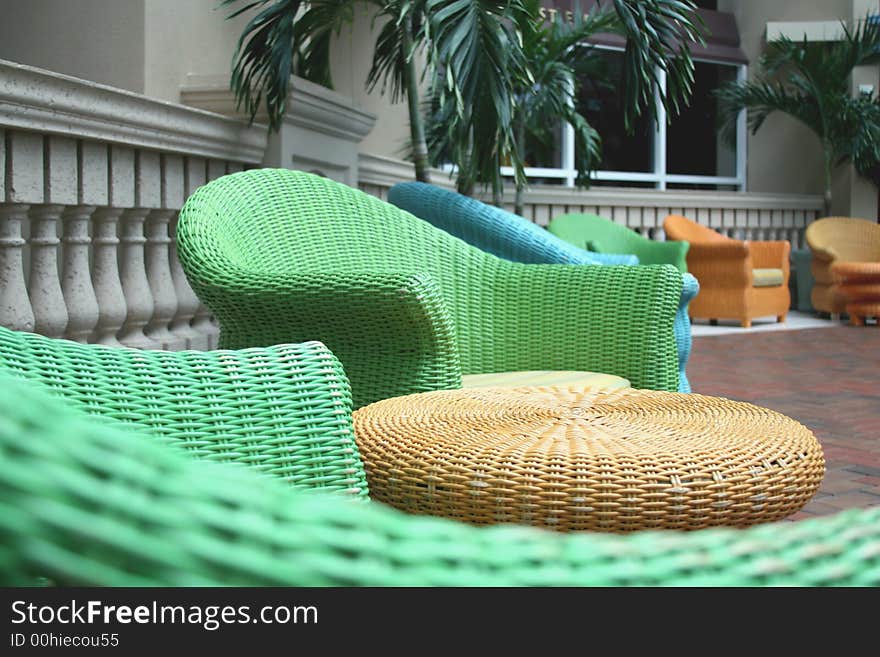 Colorful chairs outside a room at a vacation resort