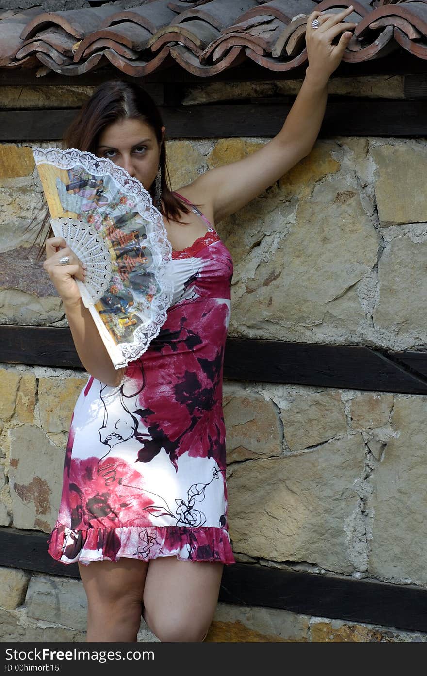 Young pretty  girl  holding traditional fan. Young pretty  girl  holding traditional fan