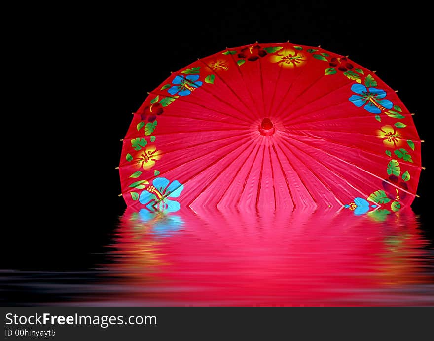 Colorful red unbrella, opened in puddle of water, with reflection. Colorful red unbrella, opened in puddle of water, with reflection.