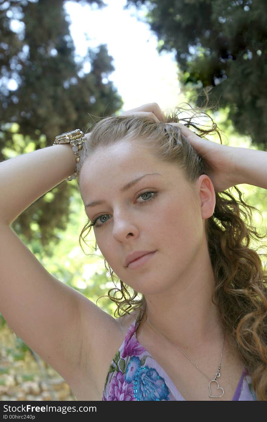 A portrait of the young woman on a background of a wood. A portrait of the young woman on a background of a wood.