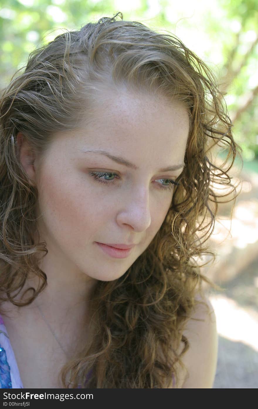 A portrait of the young woman on a background of a wood. A portrait of the young woman on a background of a wood.