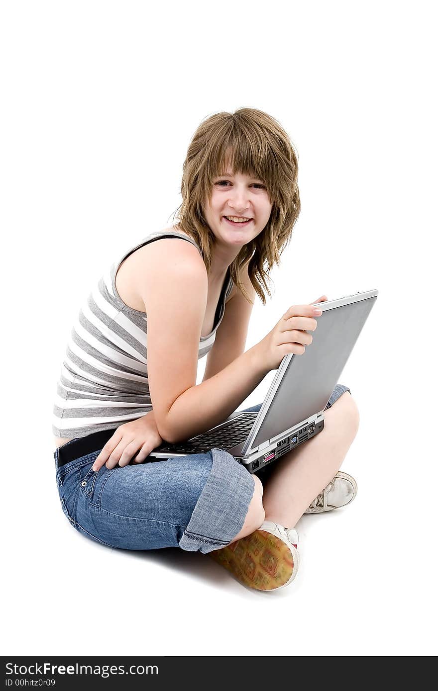 Teen girl is smiling with computer. Teen girl is smiling with computer