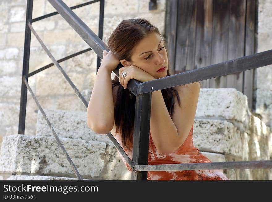 Young woman looking up outdoors