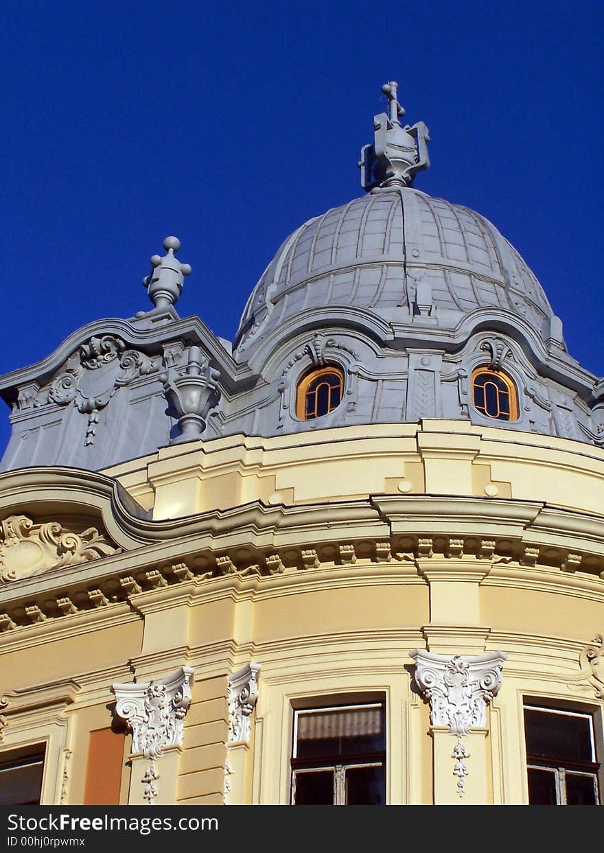 A tower of a building on a blue sky. A tower of a building on a blue sky