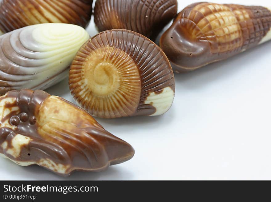 Close up of mixed chocolates isolated on white