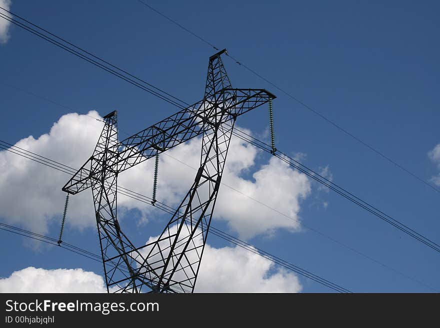 Transmission line on a background of the dark blue sky. Transmission line on a background of the dark blue sky