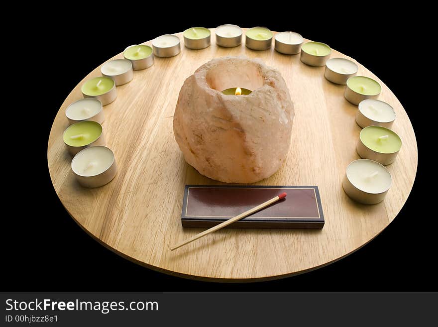 Salt Candlelamp in a group of various candles - close-up