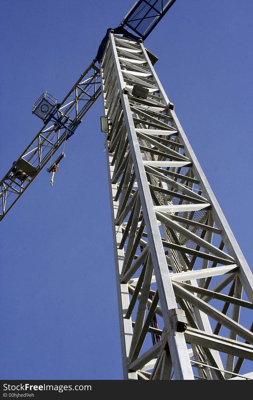 Detail of a crane against blue sky. Detail of a crane against blue sky