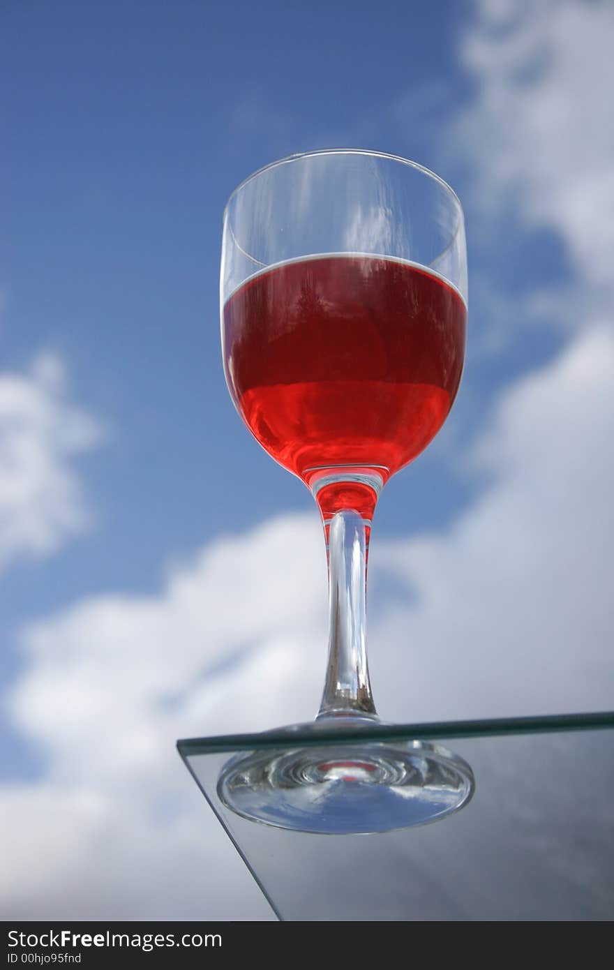 Red wine on a background of clouds