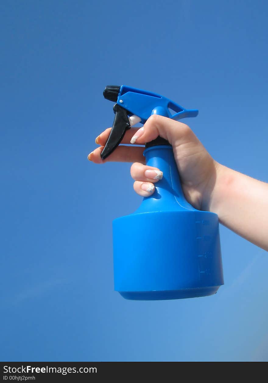 sprayer of water on blue background