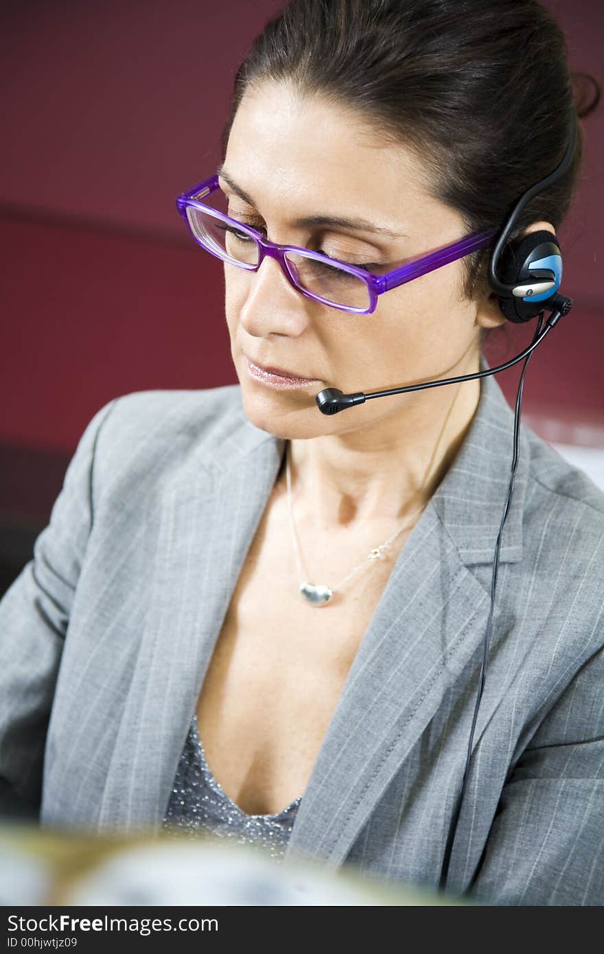 Office life: young switchboard operator representative smiling