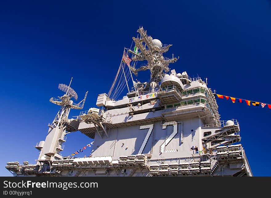 The aircraft carrier USS Abraham Lincoln docked at the Port or Everett Naval Station, WA. The aircraft carrier USS Abraham Lincoln docked at the Port or Everett Naval Station, WA