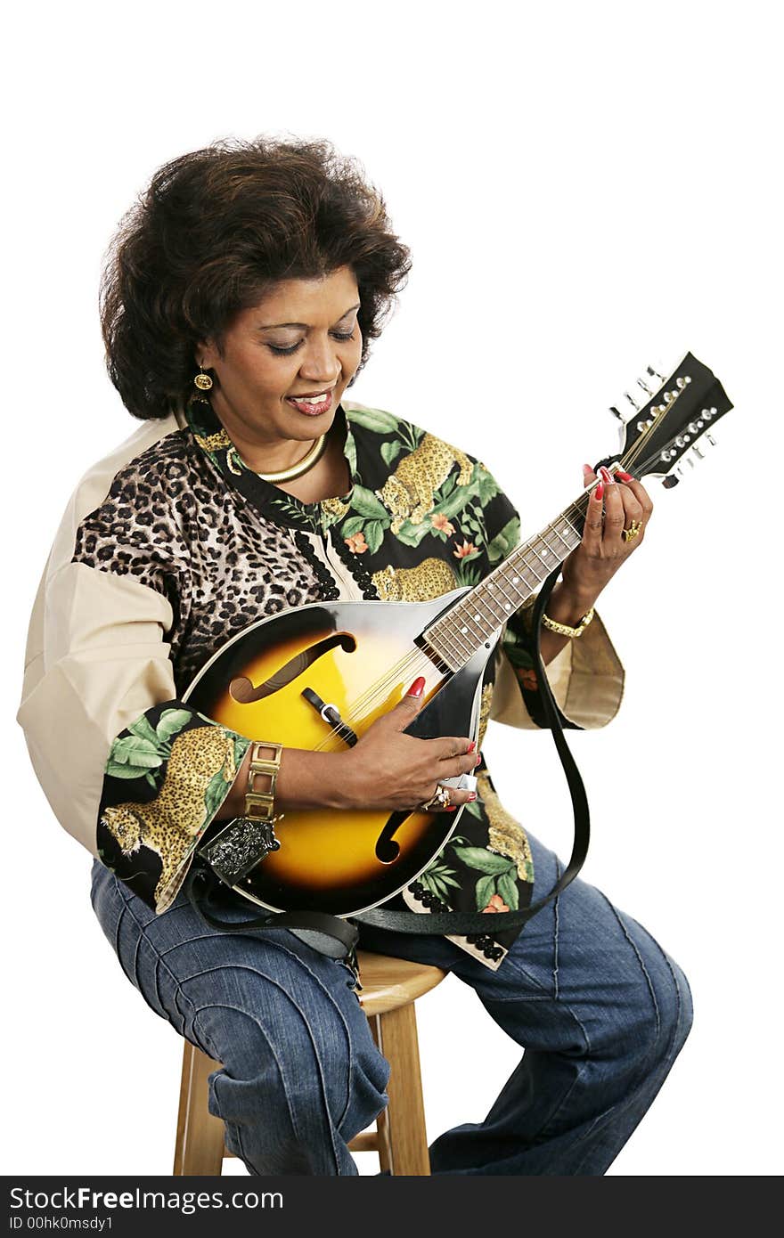 A pretty ethnic woman playing a mandolin.  Isolated on white. A pretty ethnic woman playing a mandolin.  Isolated on white.