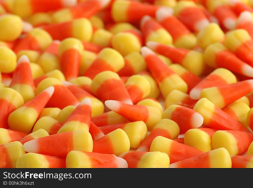 Many candy corns, sharp focus in front and blurred to back. Many candy corns, sharp focus in front and blurred to back.