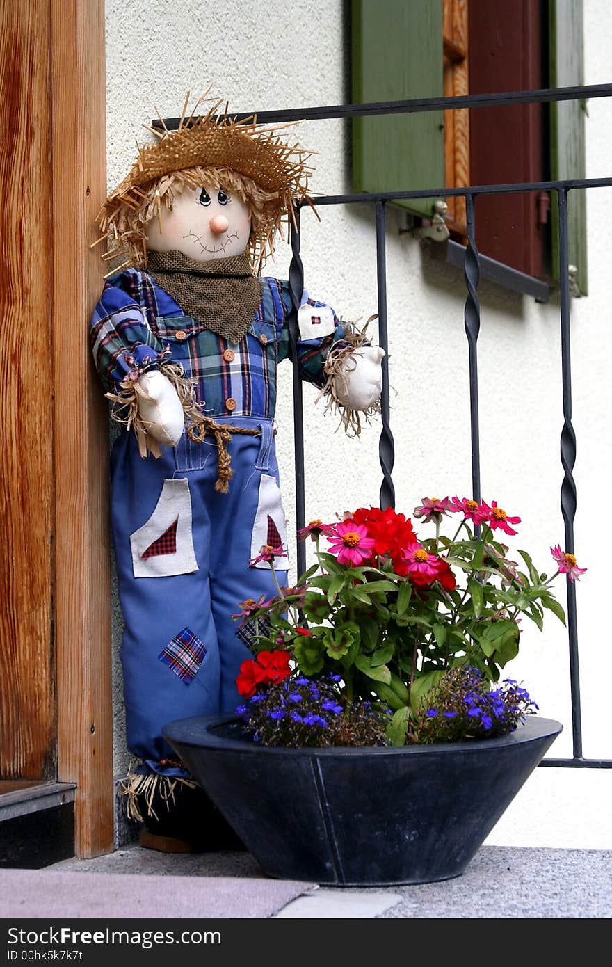 Cute Scarecrow Outside A House