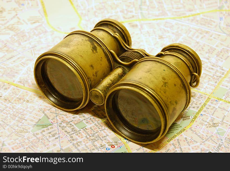 The antique binoculars on the map. The antique binoculars on the map