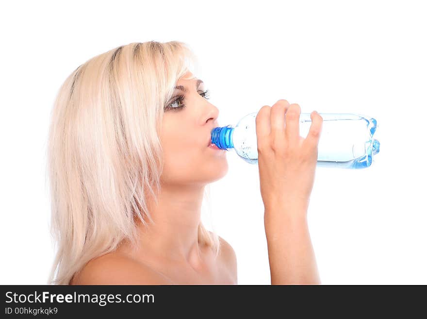 Blond with towel holding bottled wateron white. Blond with towel holding bottled wateron white