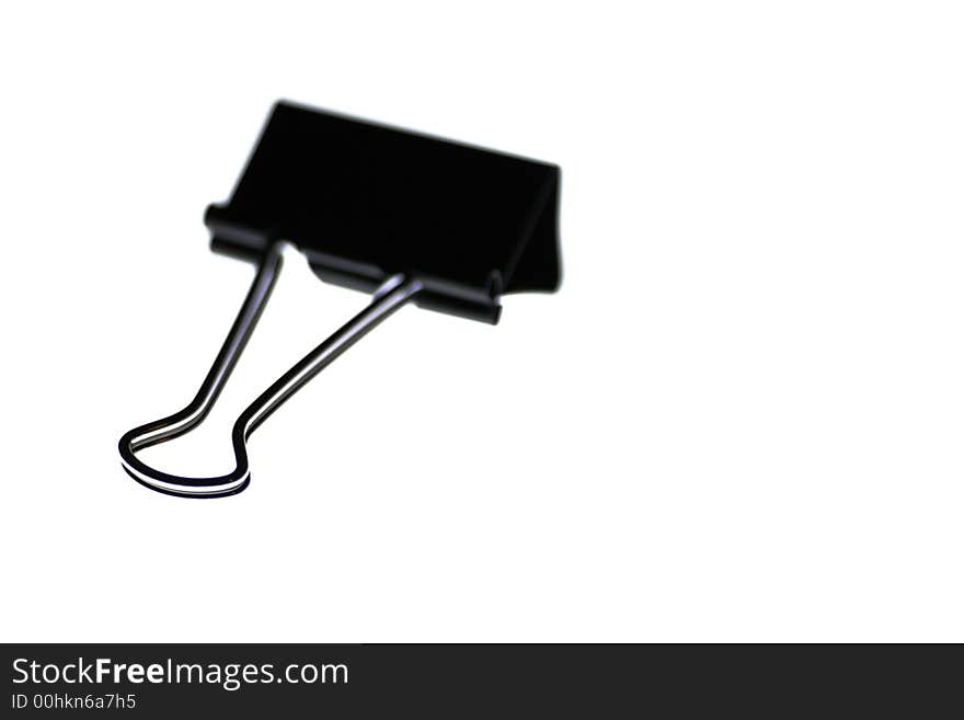 Black Metal Paper Clip On A White Background, Office Object, Stationery