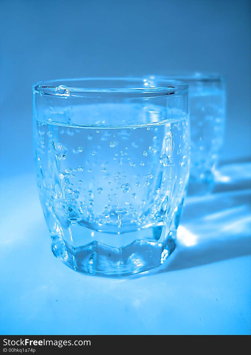 Glass With Water In Blue Color