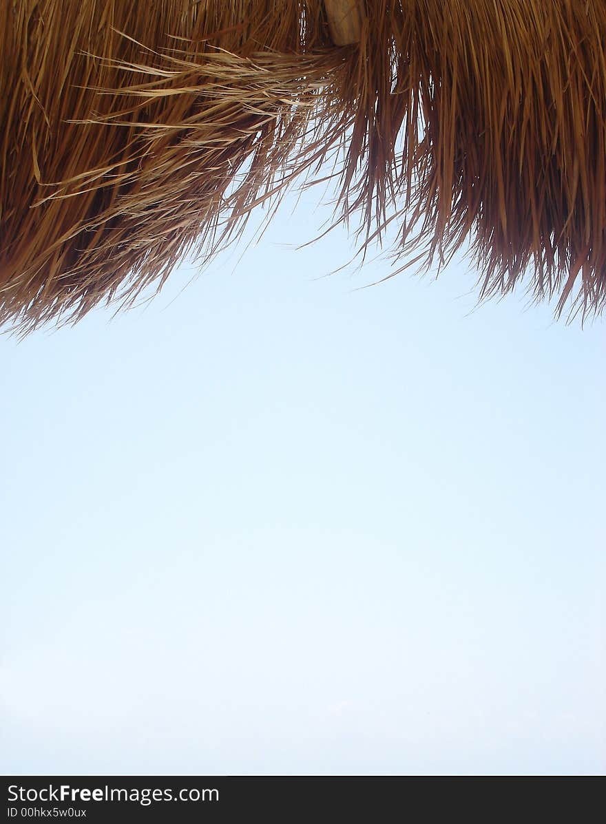 View of clear blue sky from under the Palapas