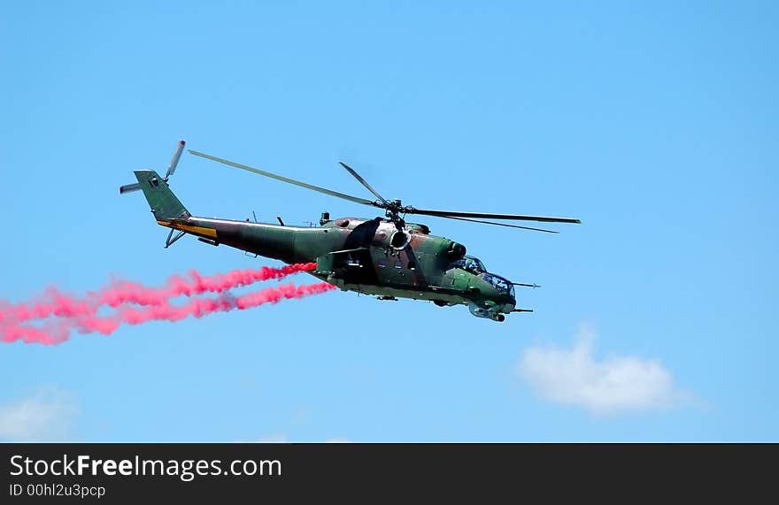 Helicopter Mi-24 opposite blue sky