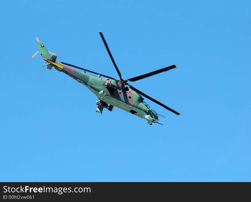 Helicopter Mi-24 opposite blue sky