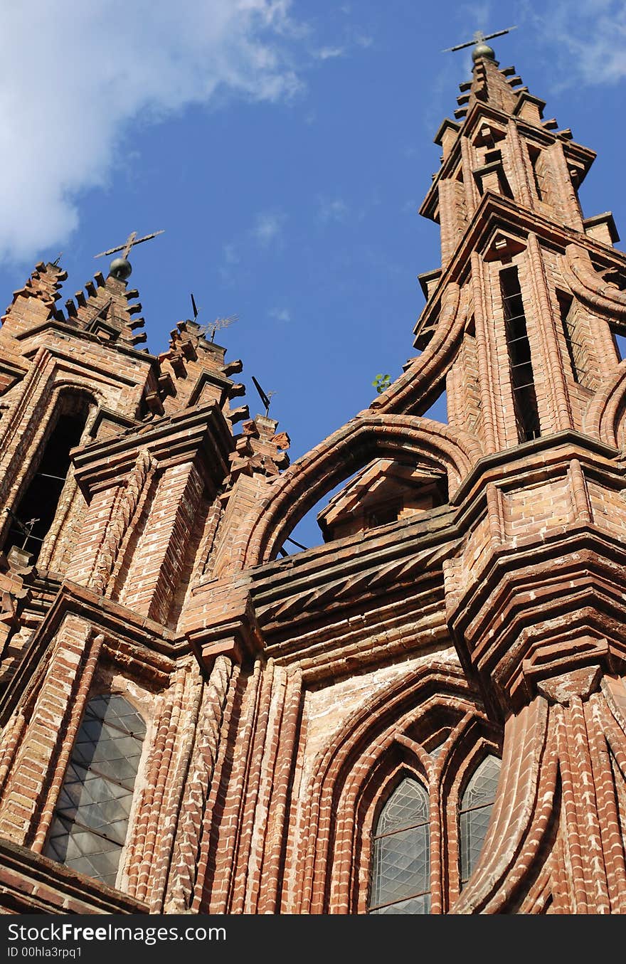 Spires going up to the sky of gothic St. Ann church in old town of Vilnius, the capital of Lithuania. Spires going up to the sky of gothic St. Ann church in old town of Vilnius, the capital of Lithuania.