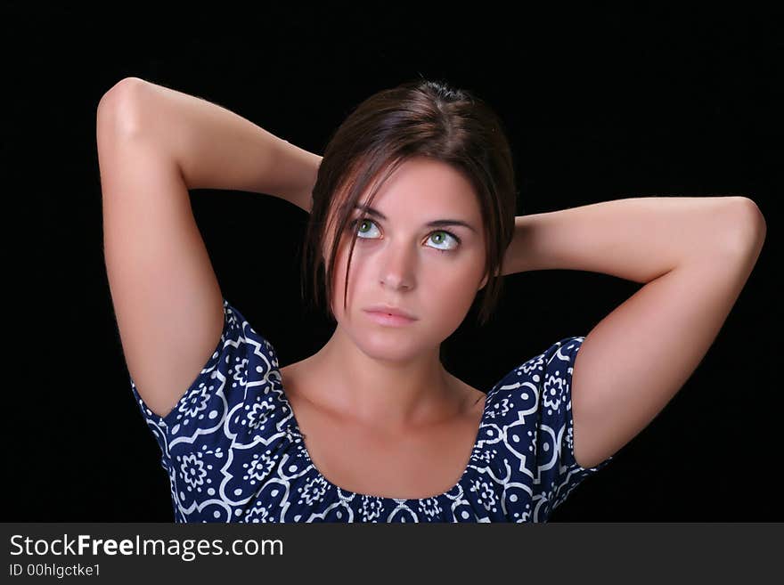 Young woman holding hands behind her head. Young woman holding hands behind her head