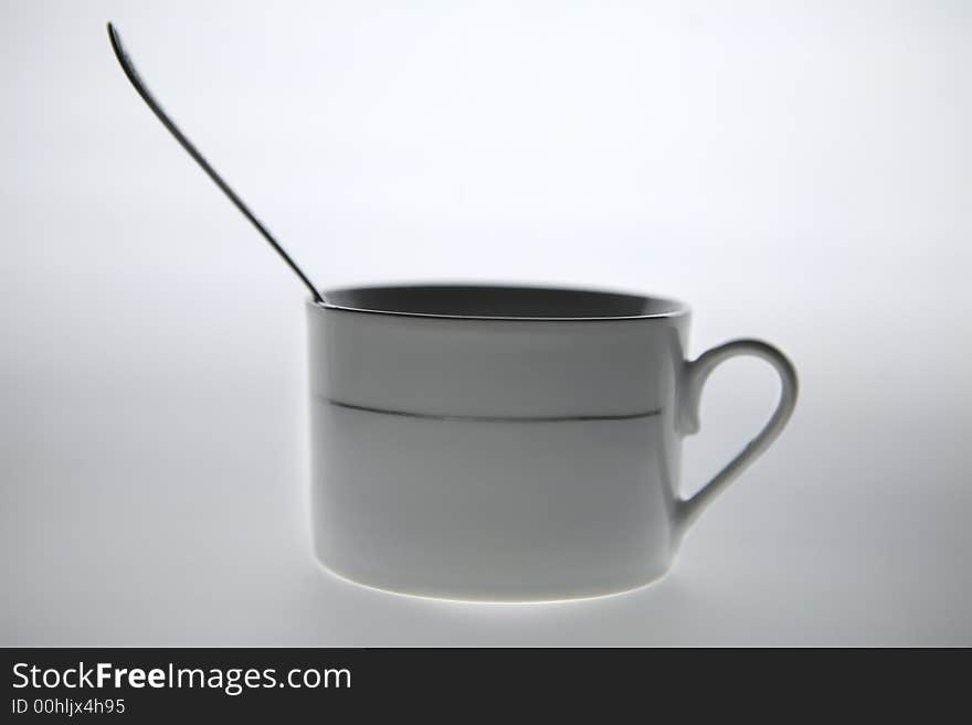 Isolated - white coffee mug with the cup into it. Isolated - white coffee mug with the cup into it