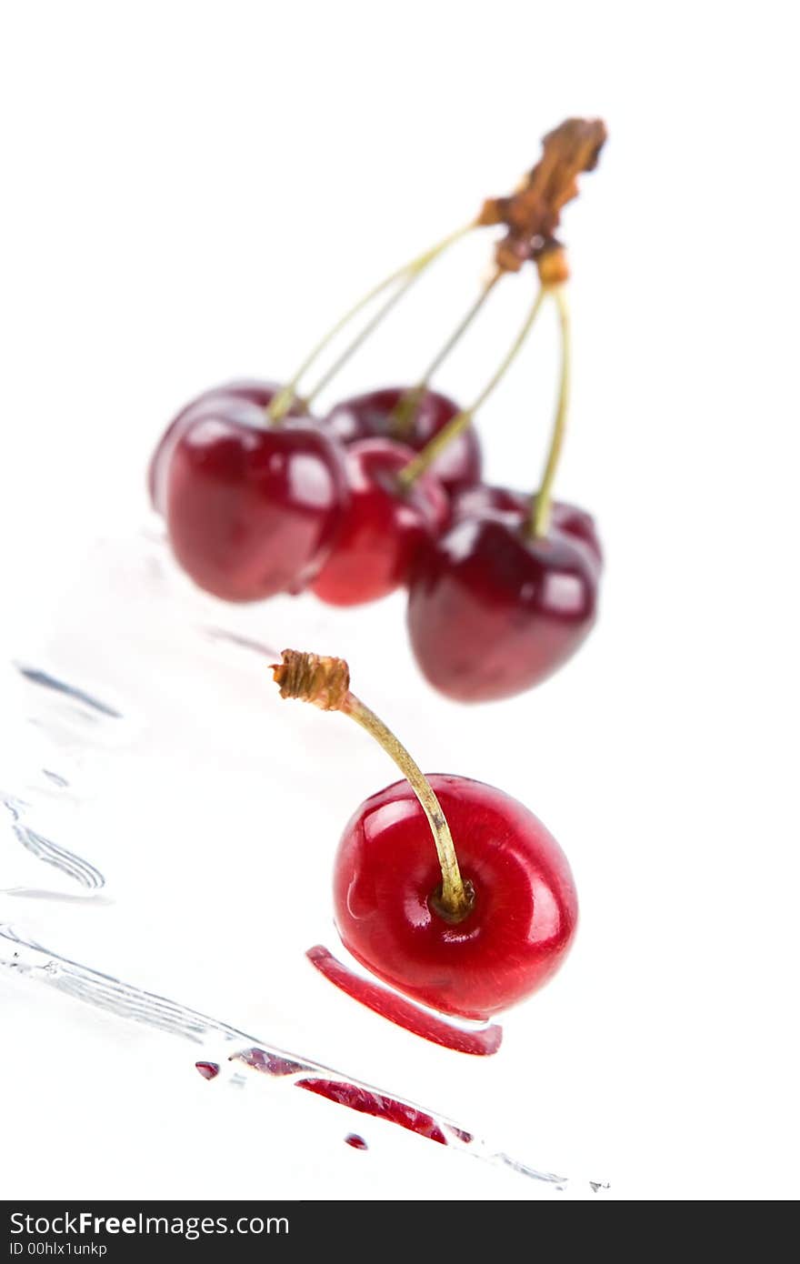 Cooled sweet cherries in drops of waters shined from below. Cooled sweet cherries in drops of waters shined from below