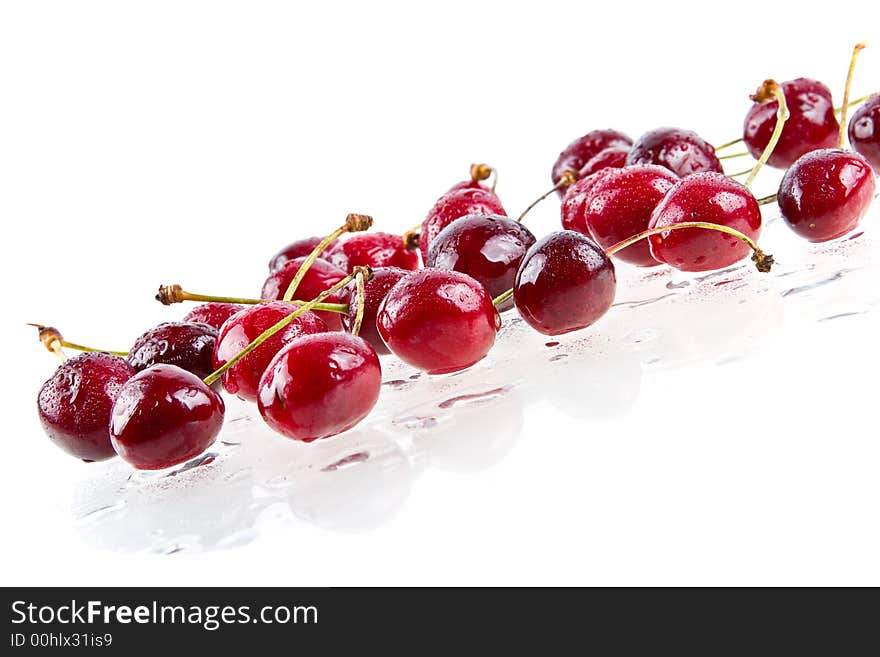 Cooled sweet cherries in drops of waters shined from below. Cooled sweet cherries in drops of waters shined from below