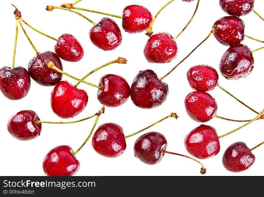 Cooled sweet cherries in drops of waters shined from below. Cooled sweet cherries in drops of waters shined from below