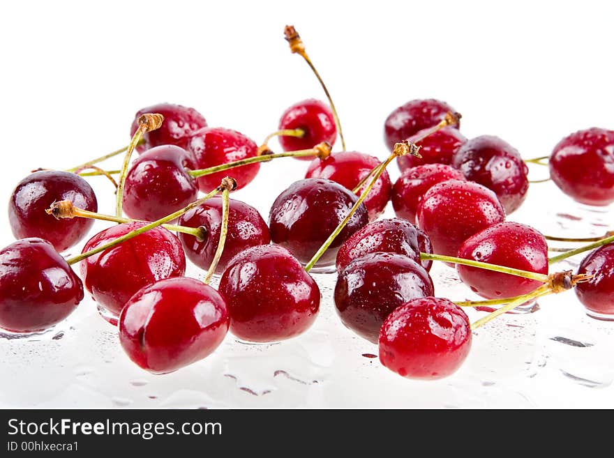 Cooled sweet cherries in drops of waters shined from below. Cooled sweet cherries in drops of waters shined from below