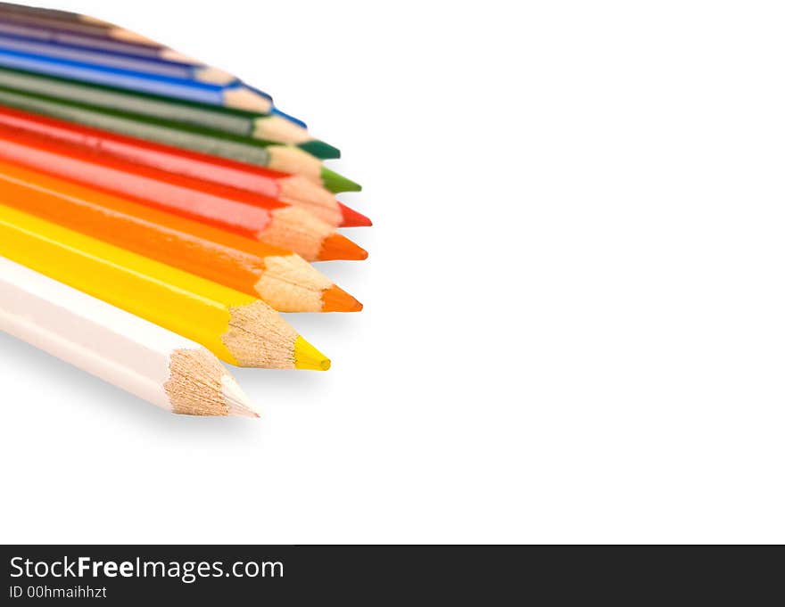 Color pencils lay on a white background. Color pencils lay on a white background