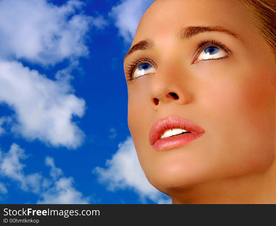 Classic Pose Of Beautiful Blond Model On Blue Sky. Classic Pose Of Beautiful Blond Model On Blue Sky