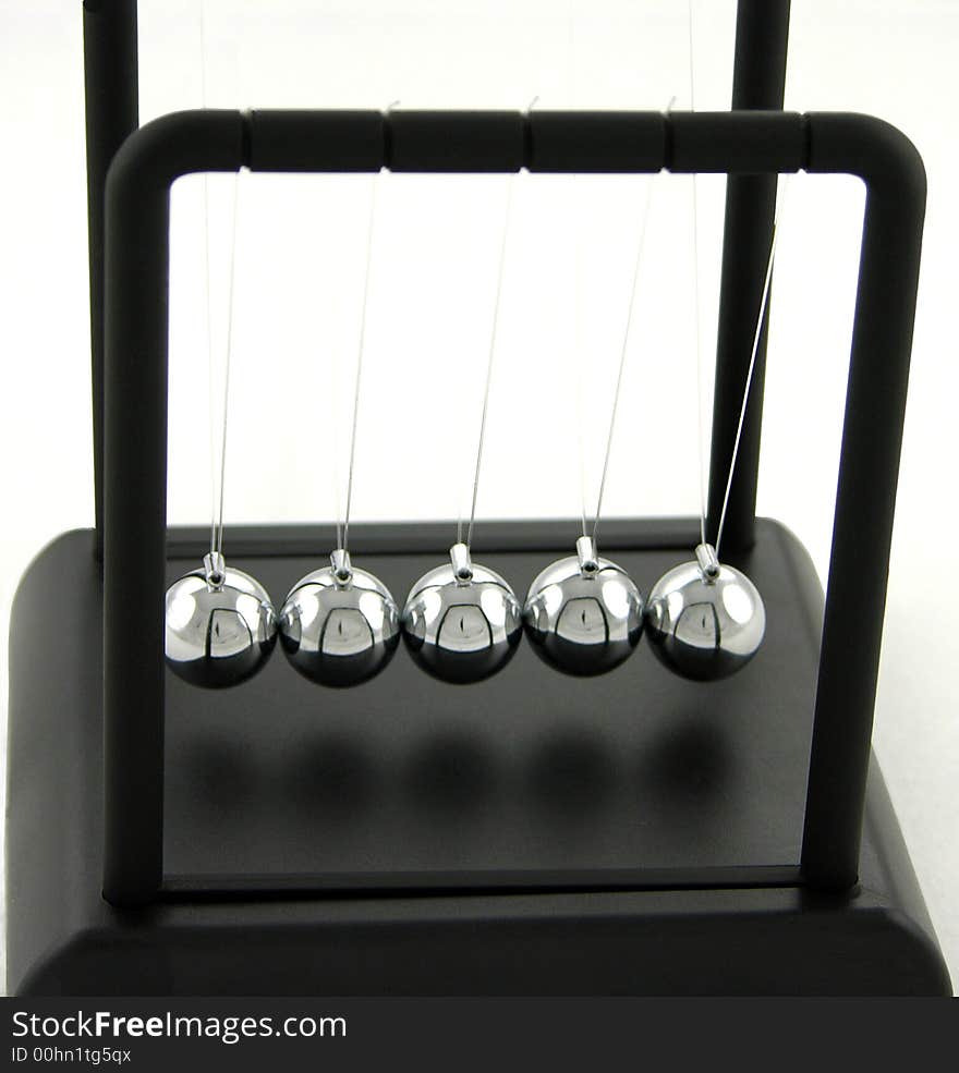 Newtons cradle waiting to be pushed at rest