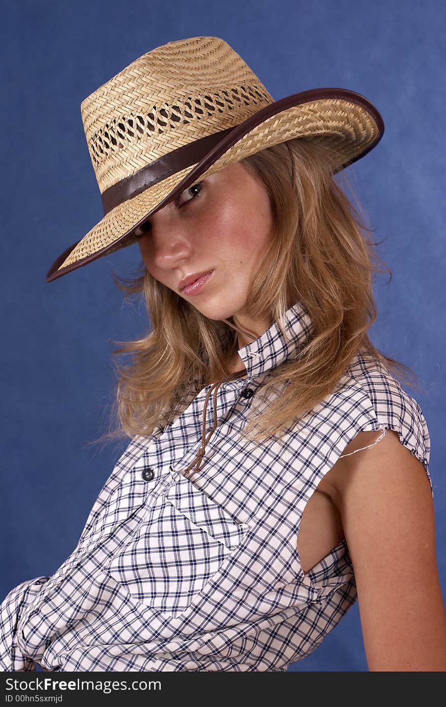 Woman and a big summer hat. Woman and a big summer hat