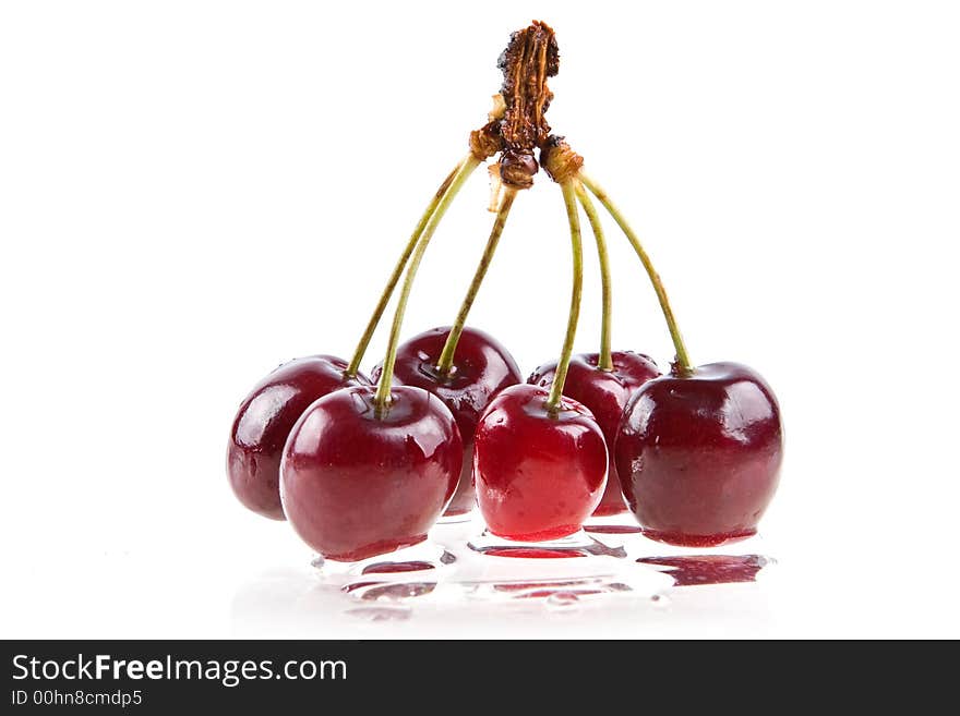 Cooled sweet cherries in drops of waters shined from below. Cooled sweet cherries in drops of waters shined from below