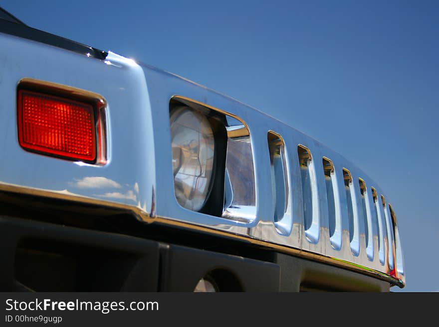 Off-road car radiator enclosure close-up against a blue sky