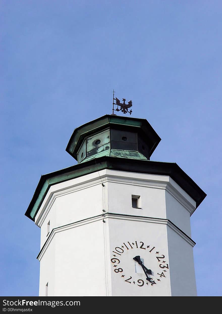 White clock tower and blue sky