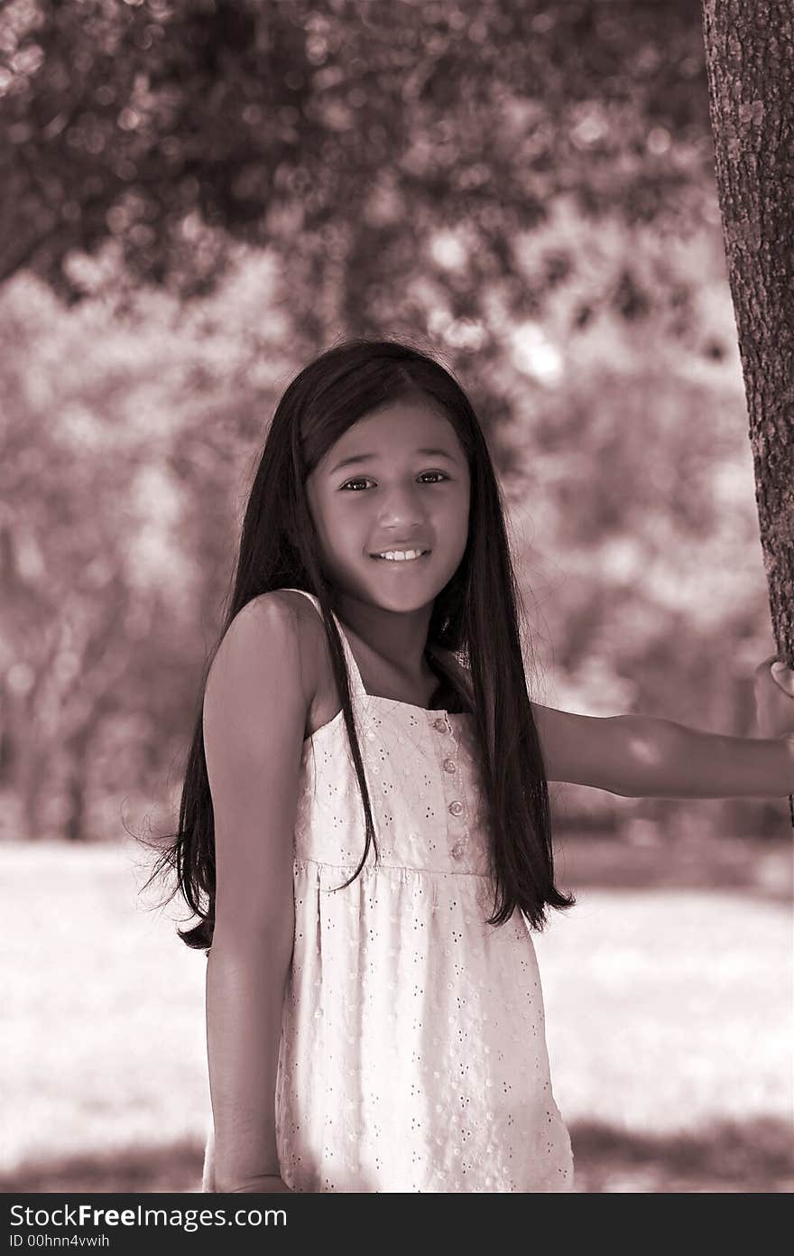 Young girl at tree