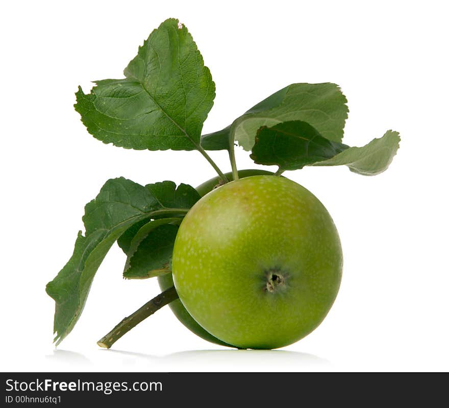 Green apple and leaves isolated over white background