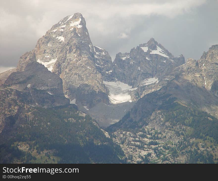 A massive snow field high up in the Teton range. A massive snow field high up in the Teton range.