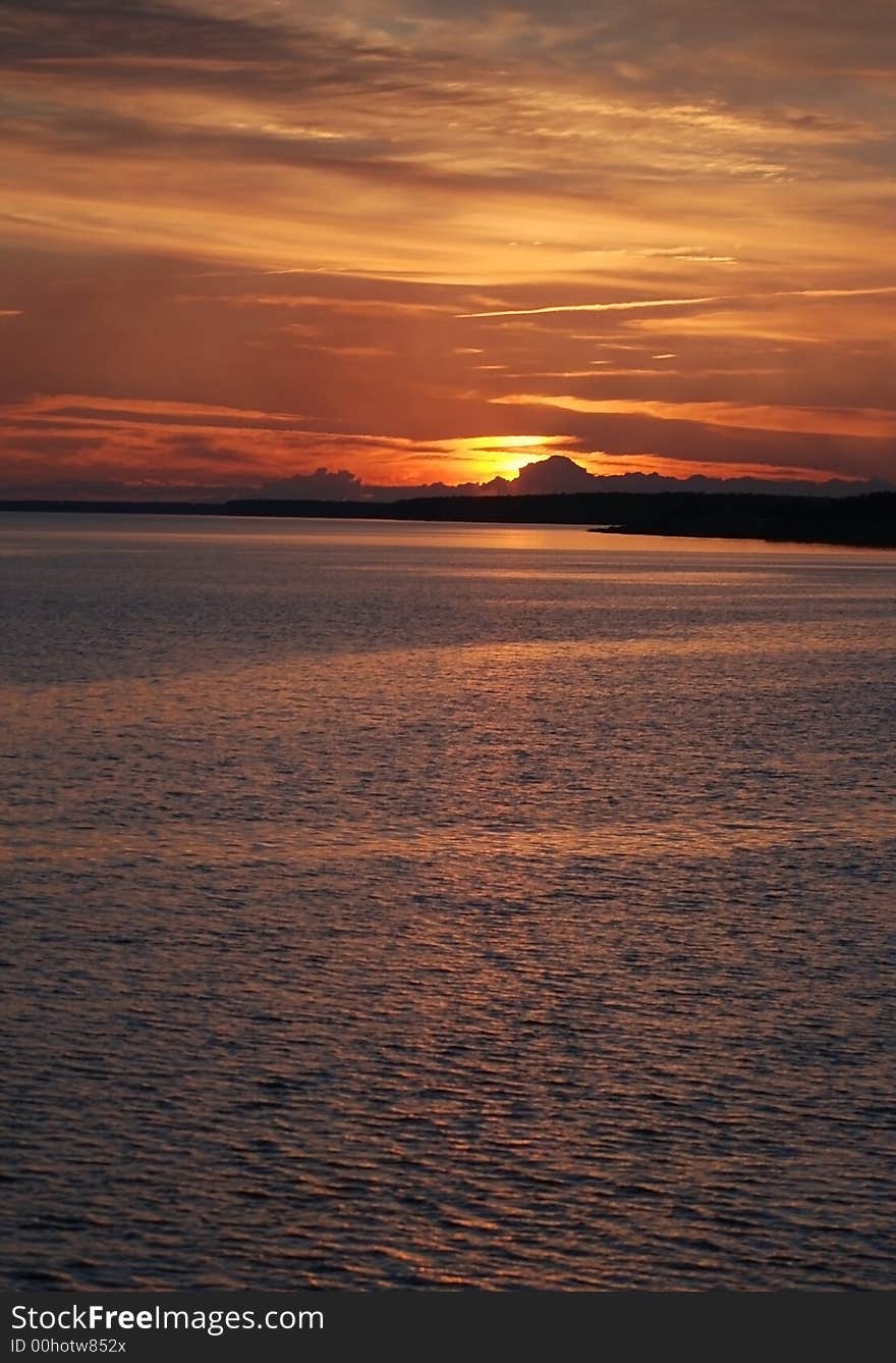 Warm summer sunset in a river. Warm summer sunset in a river