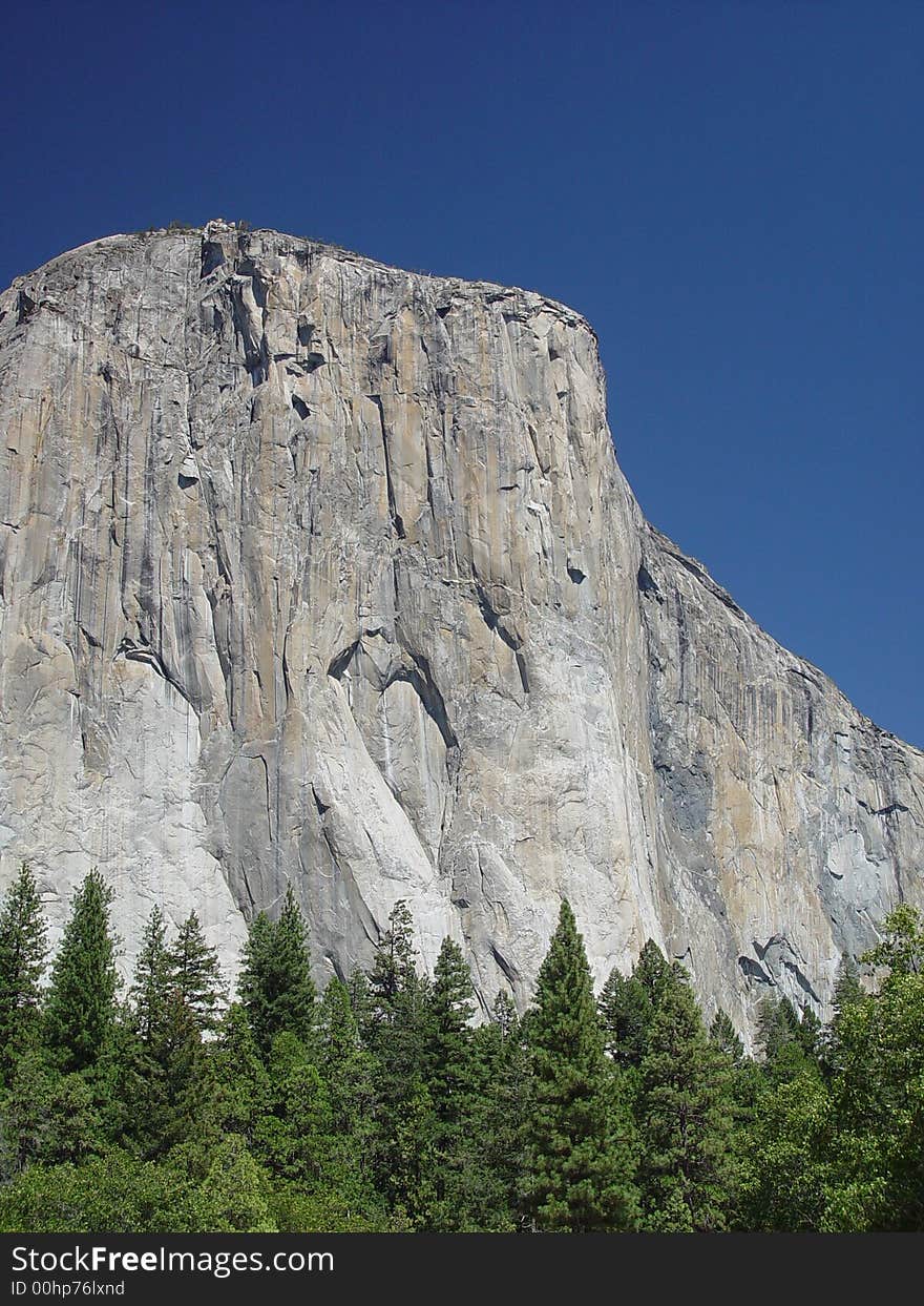 A four thousand foot cliff of glacier carved white granite. A four thousand foot cliff of glacier carved white granite.