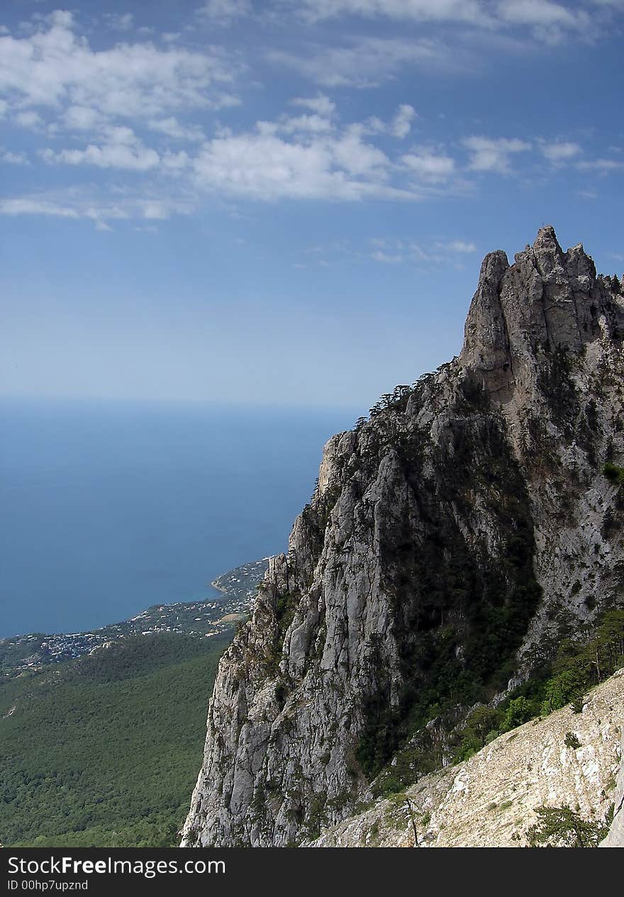 Big rocky mountains, sea and sky. Big rocky mountains, sea and sky