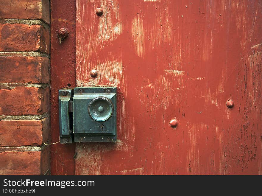 Close-up of Abandoned Building Doorknob and Brick Wall. Close-up of Abandoned Building Doorknob and Brick Wall.