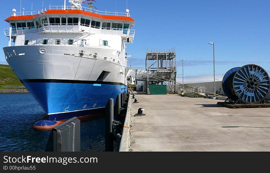 A look down the quayside from the restricted access end, ferry berthed, passenger gangway, industrial reel of SWR, a working pier.