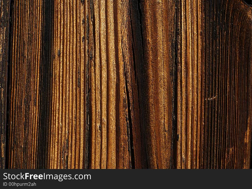 Wood detail - old rough, board background with clear wood grain. Wood detail - old rough, board background with clear wood grain.