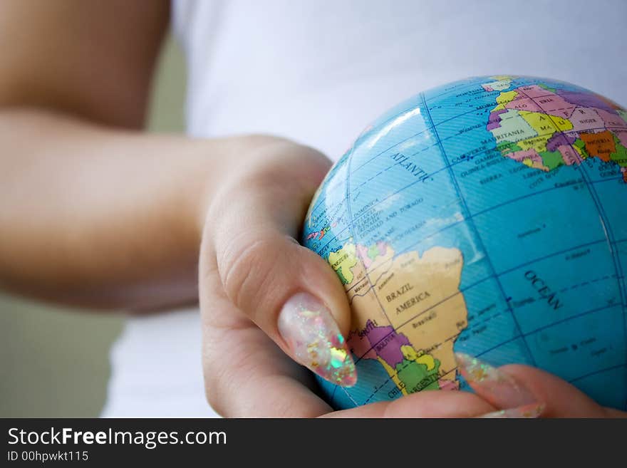 Girl holding globe in hands